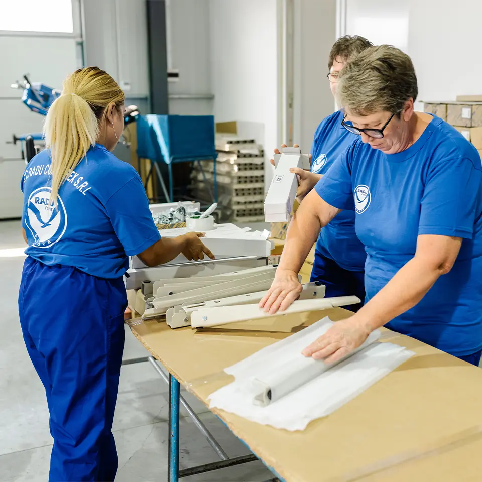 Man Using Measuring Tape in Factory Setting Man Using Measuring Tape in Factory Setting